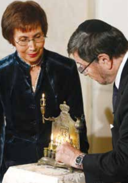 Judea and Ruth Pearl, the parents of slain WSJ journalist Daniel Pearl, light a Hanukkia at a Hanukkah reception at the White House in 2007. Ruth died on July 20, 2021, at the age of 85. Source: Jim Young/Reuters