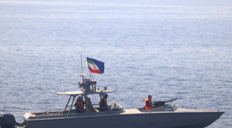 : In this photo made available by the U.S. Navy, a boat of Iran’s Islamic Revolutionary Guard Corps Navy (IRGCN) operates in close proximity to patrol coastal ship USS Sirocco (PC 6) and expeditionary fast transport USNS Choctaw County (T-EPF 2) in the Strait of Hormuz on June 20, 2022.
