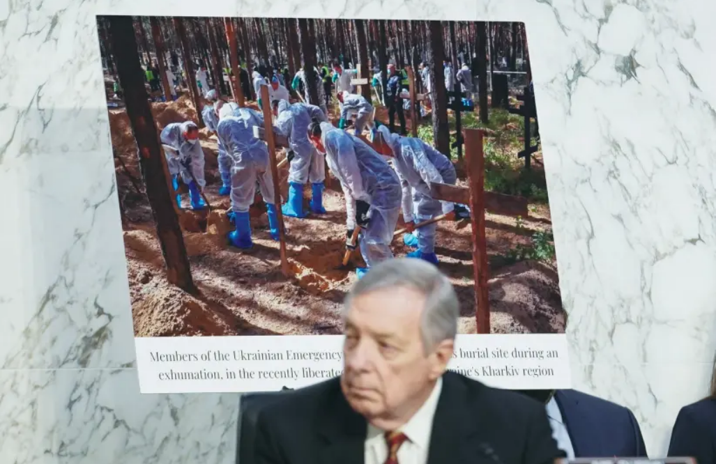 Photo: US SENATE Judiciary Committee Chairman Dick Durbin (D-IL) sits alongside a photo from the war in Ukraine during a committee hearing, last month. According to ‘The New York Times,’ Durbin has said Saudi Arabia wants Russia to win the war. (photo credit: REUTERS)
