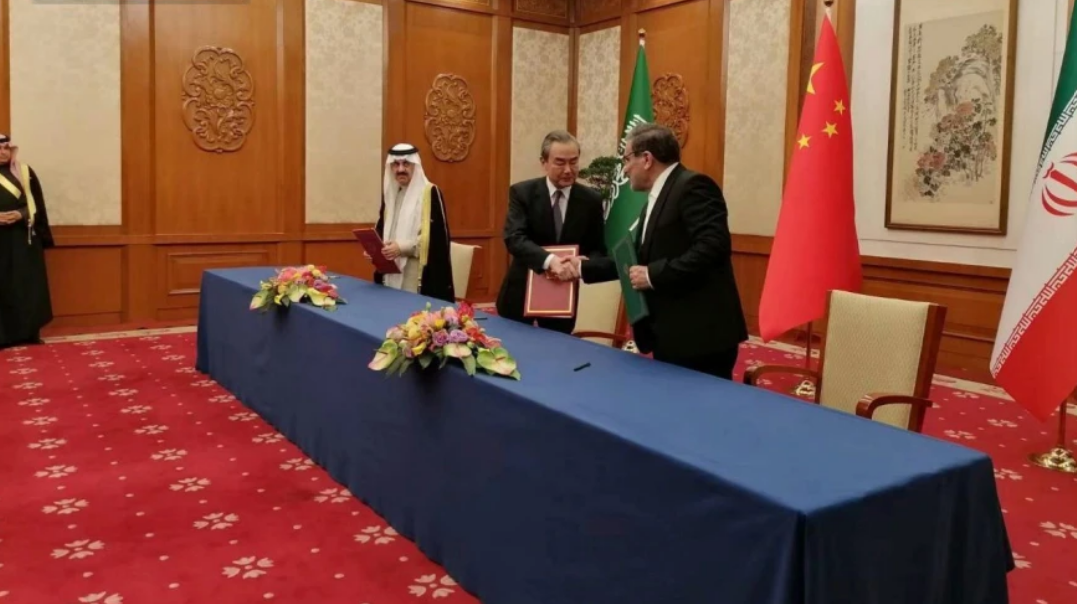 Nournews via AP In this photo released by Nournews, Secretary of Iran’s Supreme National Security Council, Ali Shamkhani, right, shakes hands with China’s most senior diplomat Wang Yi, as Saudi Arabia’s National Security Adviser Musaad bin Mohammed al-Aiban looks on during an agreement-signing ceremony between Iran and Saudi Arabia to reestablish diplomatic relations and reopen embassies after seven years of tensions between the Mideast rivals, in Beijing, on March 10, 2023.