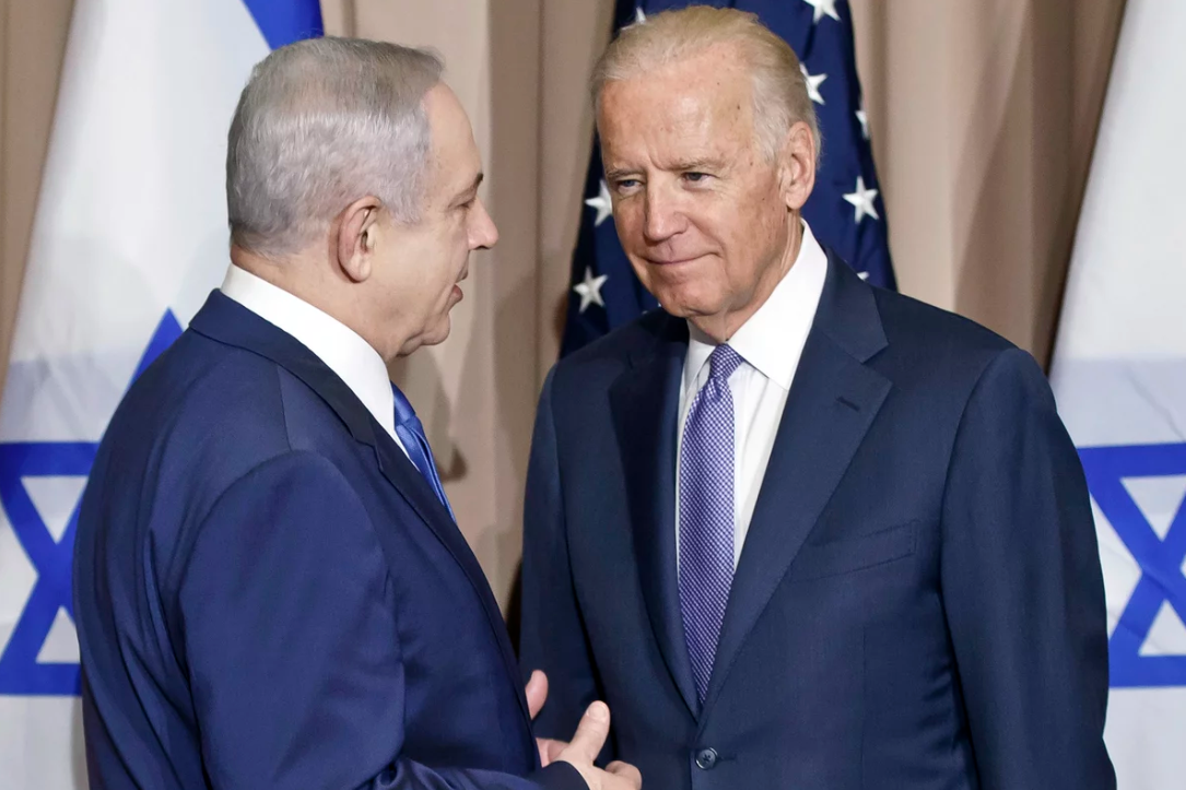 Photo: Israeli Prime Minister Benjamin Netanyahu (left) and then-Vice President Biden talk prior to a meeting on the sidelines of the World Economic Forum in Davos, Switzerland, Jan. 21, 2016. Source: Michel Euler/AP, Caption: NPR.