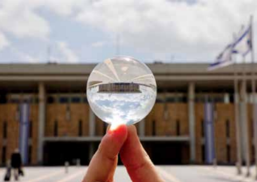 Photo: A topsy-turvy Knesset seen through a crystal ball. Source: Marc Israel Sellem. Photo and caption from The Jerusalem Report.